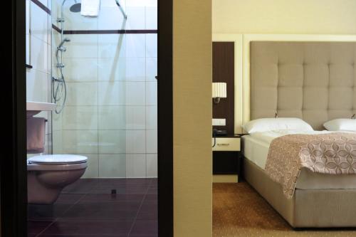 Koupelna v ubytování Hotel Atlas Halle