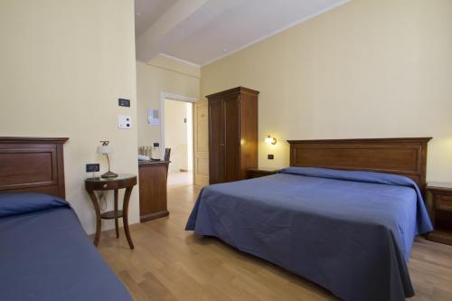Postel nebo postele na pokoji v ubytování Hotel Primula
