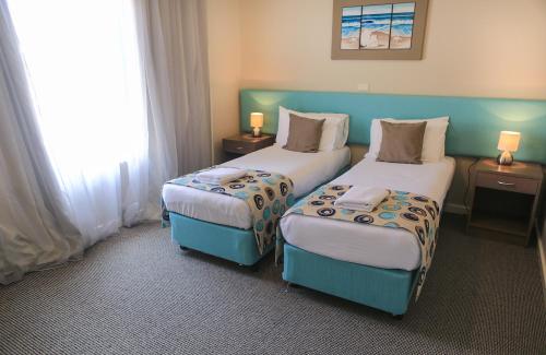 Postel nebo postele na pokoji v ubytování Marina Hotel