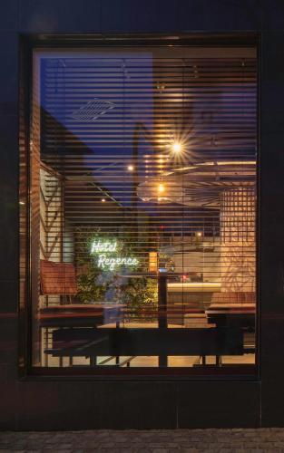 a window with a bench in front of a building at Best Western Plus Hotel Regence in Aachen