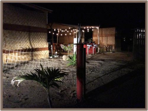 a pole with lights on it in front of a building at Camp - Santos Cabana Santino in Todos Santos