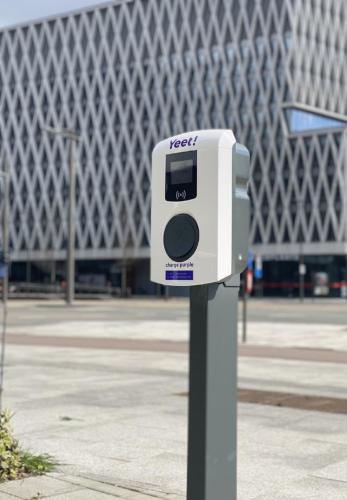 a pay meter on a pole in front of a building at Holiday Inn Express Antwerpen City North by IHG in Antwerp