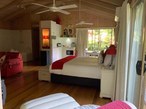 a bedroom with a bed and a ceiling fan at Belle's at Montville in Montville