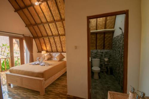Ένα ή περισσότερα κρεβάτια σε δωμάτιο στο kaje cottage & restaurant