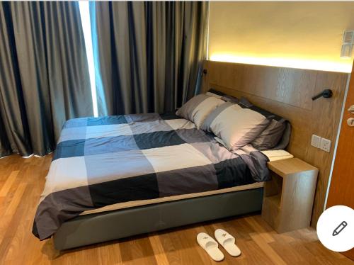 Un pat sau paturi într-o cameră la Genting GEO 38 Resident unicorn