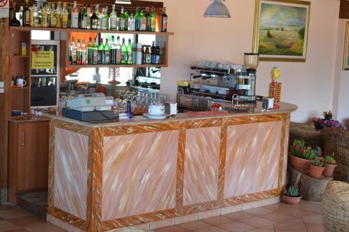 a bar in a restaurant with a counter at Residence New Paradise in Tropea