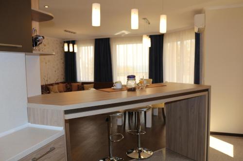 Kuchyň nebo kuchyňský kout v ubytování Vello Apartments