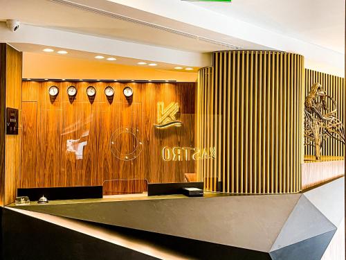 a dressing room with wooden walls and clocks on the wall at Kastro Hotel in Heraklio Town