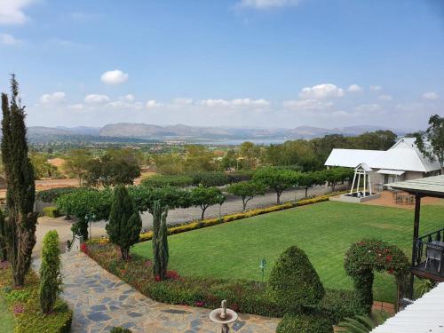 a view of a garden with a gazebo at Villa Paradiso in Hartbeespoort