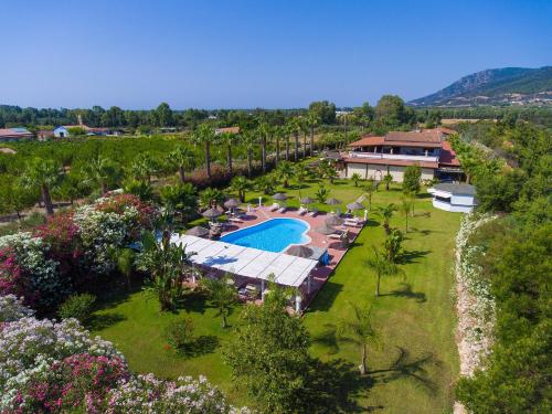 an aerial view of a resort with a swimming pool at Hotel Rurale Orti di Nora & SPA in Santa Margherita di Pula