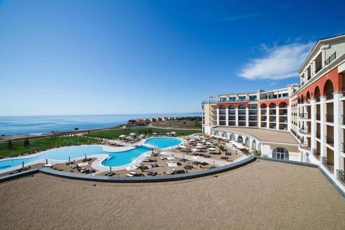 an aerial view of a resort with a swimming pool at Apartment with balcony, Lighthouse Golf Resort, 62sqm in Balchik