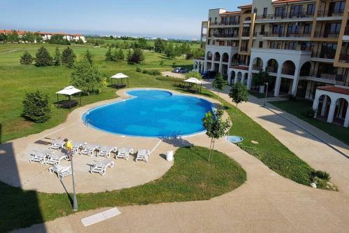 an overhead view of a swimming pool in front of a building at Apartment with balcony, Lighthouse Golf Resort, 62sqm in Balchik