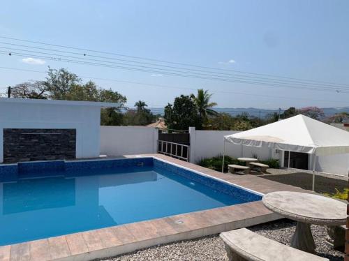 a swimming pool in front of a villa at Lofts Zaragoza in Valles