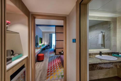 a bathroom with a sink and a mirror at La Quinta by Wyndham Dubai Jumeirah in Dubai