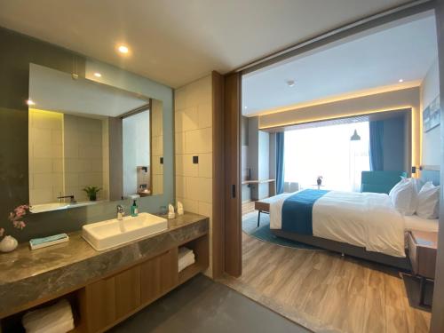 Ένα ή περισσότερα κρεβάτια σε δωμάτιο στο Holiday Inn Express Liaocheng Chiping by IHG