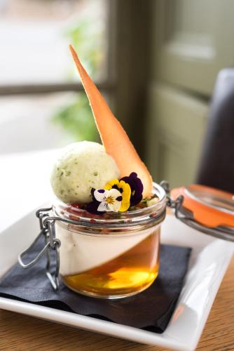 a jar of ice cream with a carrot stick in it at The Lodge in Hunstanton