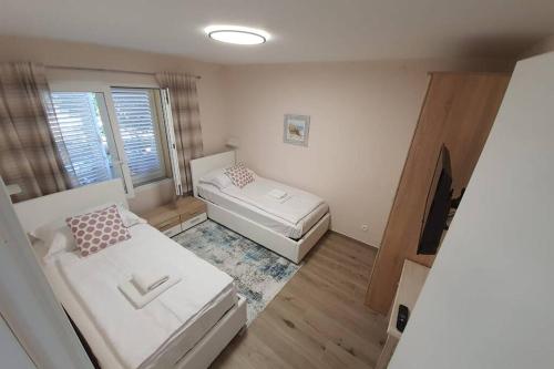 Säng eller sängar i ett rum på Apartment Punta skala Villa Valentina