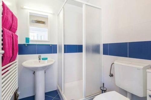 a bathroom with a white toilet and a sink at Breathtaking sea view app for 2+1, BBQ ...... in Opatija