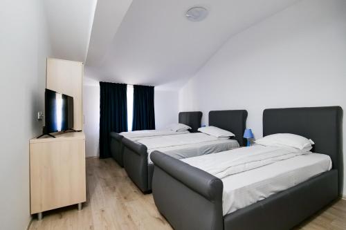 Postel nebo postele na pokoji v ubytování Hotel Ema&Zain