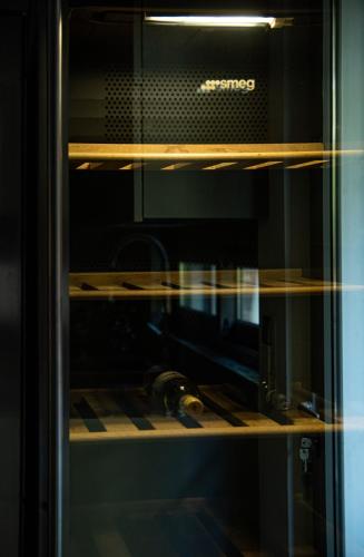 a glass door of an oven with some tools in it at Elegant and Private Living by Neuvel in Athens