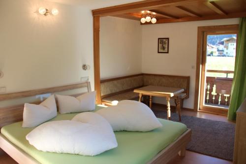 a bedroom with two white pillows on a bed at Gielerhof in Zell am Ziller