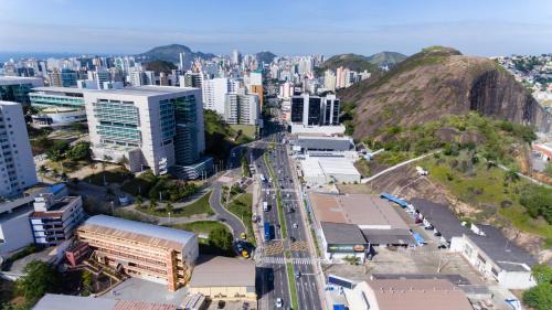 an aerial view of a city with buildings and a mountain at ibis budget Vitoria in Vitória