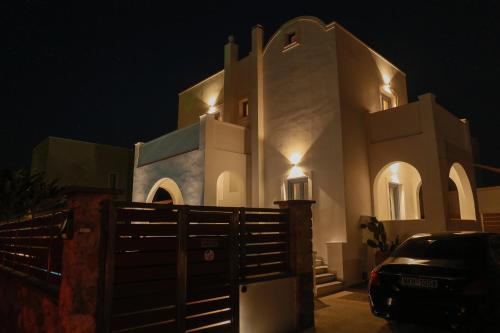 a church at night with a car parked in front at The Z Private Villa, Santorini in Monolithos
