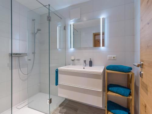 a bathroom with a sink and a shower at Appartement Ambiente in Hopfgarten im Brixental