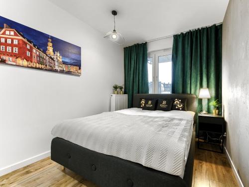 Posteľ alebo postele v izbe v ubytovaní Apartament Bóżnicza