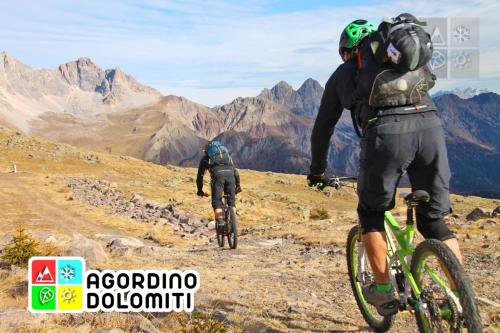two people riding bikes on a mountain trail at LA PITA in La Valle