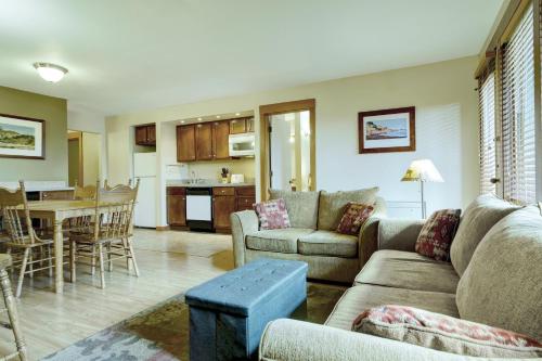 a living room with a couch and a table at Seventh Mountain Resort in Bend