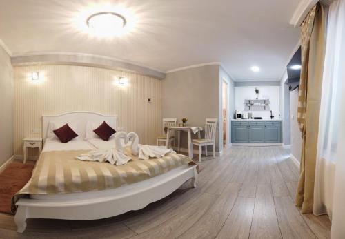 a bedroom with a bed with two swans on it at Casa Brainer in Sibiu