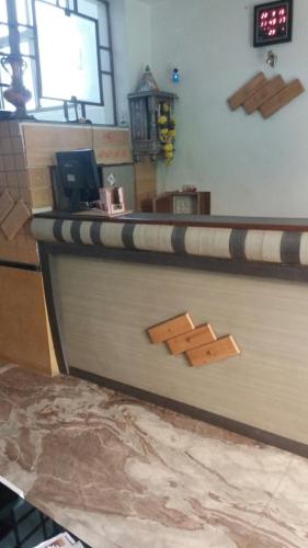 a counter in a fast food restaurant with a counter sidx sidx at R.J.Residency in Ahmedabad