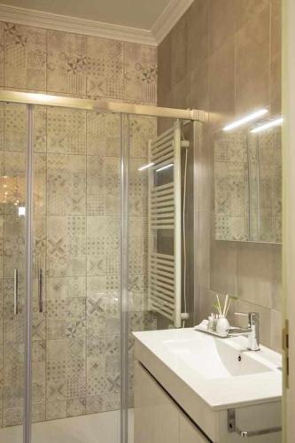 a bathroom with a sink and a shower at Casa da Granja - Boutique in Vila Nova de Gaia