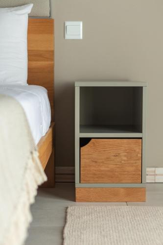 a bedroom with a bed and a nightstand with a bed sidx sidx at Villa dei Venti in Qala
