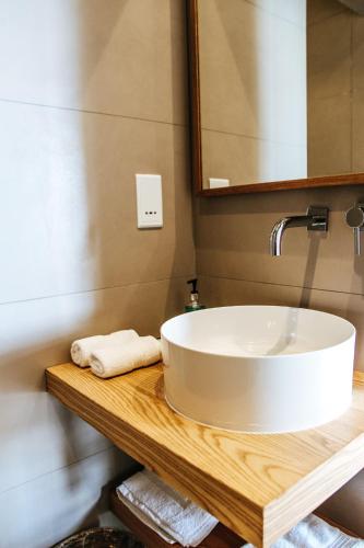 a bathroom with a white sink and a mirror at Villa dei Venti in Qala