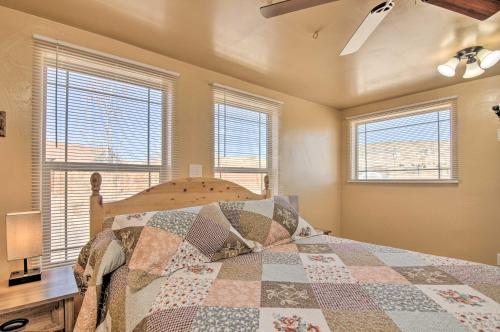 a bedroom with a bed with a quilt on it at Cozy Home with Canyon Views 2 Mi to Grand Staircase in Henrieville