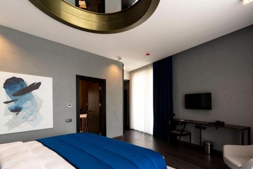 Ένα ή περισσότερα κρεβάτια σε δωμάτιο στο Hotel Bonvie