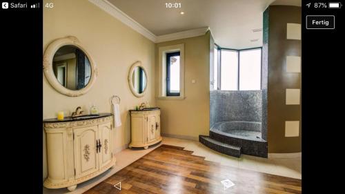 a bathroom with a tub and a sink and a shower at Exclusive VILLA Volme in Banjole
