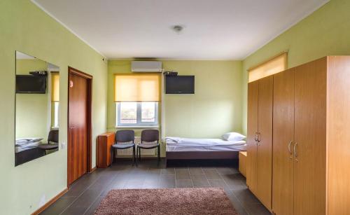 Ένα ή περισσότερα κρεβάτια σε δωμάτιο στο Green Hotel