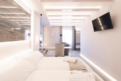 Katil atau katil-katil dalam bilik di Hotel 1877 Sensaciones & SPA ADULTS ONLY