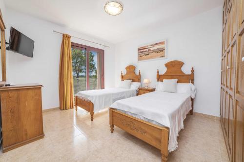 Postel nebo postele na pokoji v ubytování Villa MENORCA by Mallorca Villa Selection