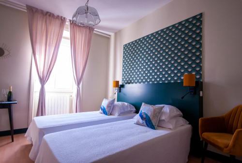 Posteľ alebo postele v izbe v ubytovaní Grand hôtel de l'Europe