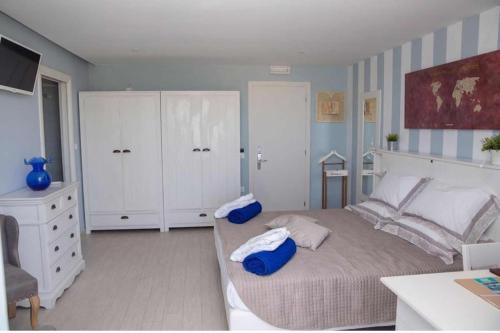 Postel nebo postele na pokoji v ubytování Sidari Beach Hotel