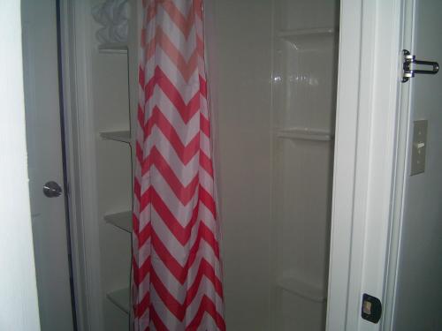 a red and white striped tie in a closet at Green Mountain Cabins in Killington