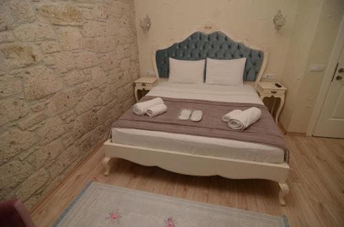 Ένα ή περισσότερα κρεβάτια σε δωμάτιο στο Alacati Eldoris Butik Hotel