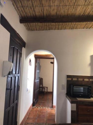 a hallway in a house with a ceiling at Refugios del Callejón in San Carlos