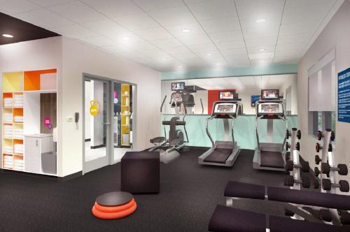 a gym with treadles and ellipticals in a room at Tru By Hilton Baton Rouge I-10 East, LA in Baton Rouge