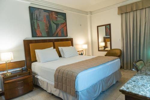 Posteľ alebo postele v izbe v ubytovaní Metropolitan Hotel