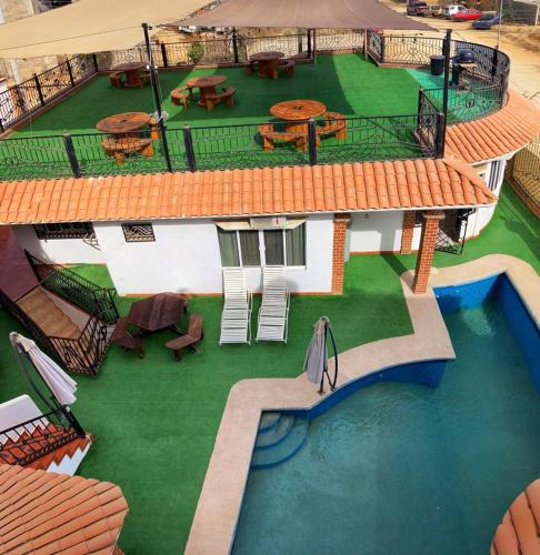 an aerial view of a house with a swimming pool at Casa del Cono in Cabo San Lucas